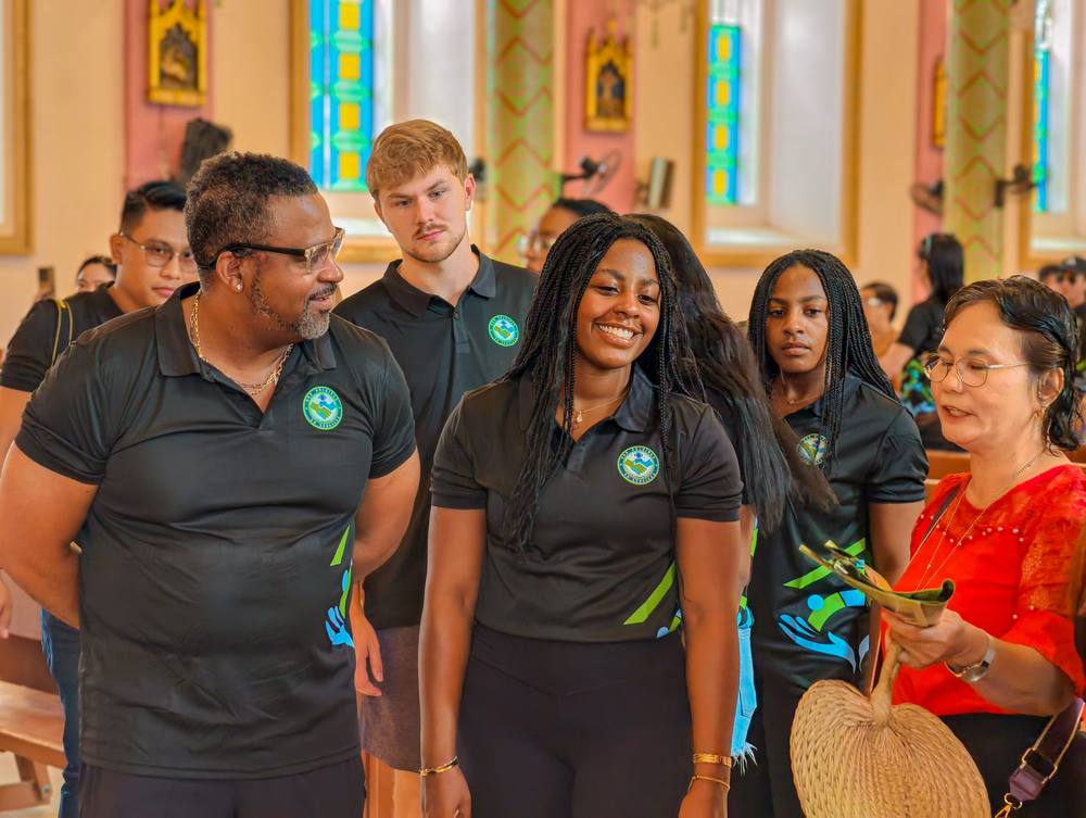 The MRD team walking through the parish church in Mambusao